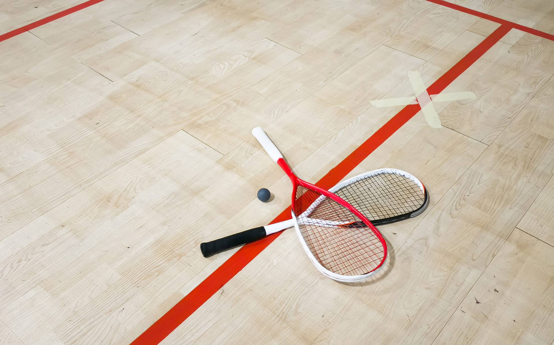 Two squash rackets on the floor
