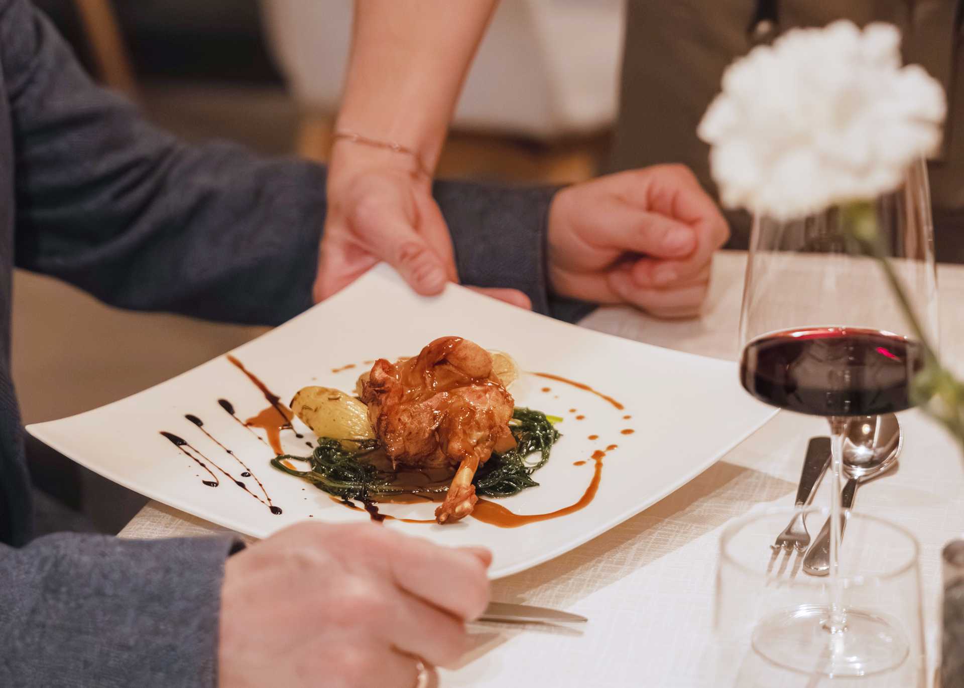 Guinea fowl and a glass of red wine Guinea fowl with a glass of Lagrein