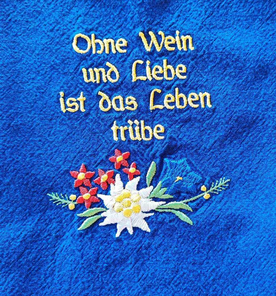 Spruch auf den blauen Bauernschürzen
