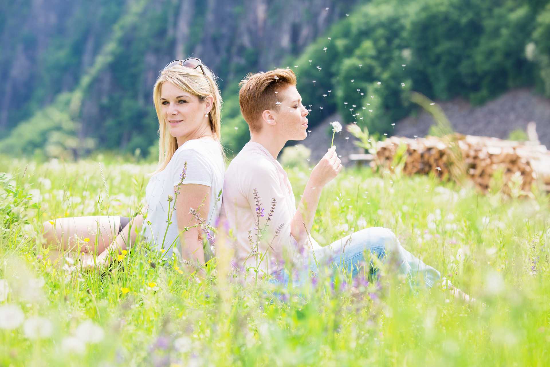 blowing a dandelion