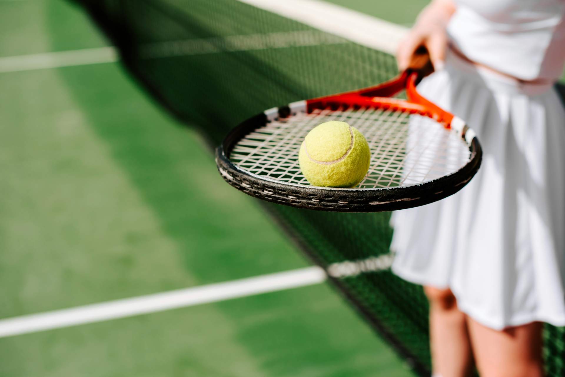 Tennis ball on the racket